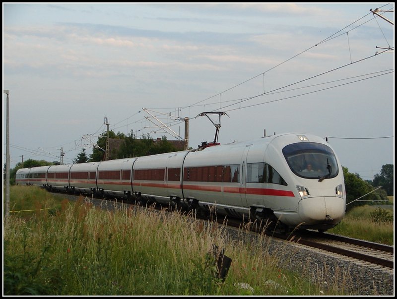 Jetzt schaffen es die BB ICE-T schon bis in den hohen Norden. ICE 1000 aus Mnchen nach Rostock am 12.06.07 kurz vor dem Rostocker Hbf.
