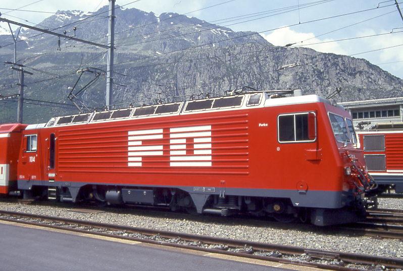 MGB exFO - HGe 4/4II 104 Name: FURKA am 01.06.1993 in ANDERMATT - Zahnrad-LOKOMOTIVE - bernahme 10.09.1986 - SLM5282/BBC - 1836 KW - Gewicht 64,00t - LP 14,78m - zulssige Geschwindigkeit 90/Z30 km/h -  Mutation: ex SBB/Brnig HGe 4/4II 1951 - 7/1990 an FO - Hinweis: noch alte Lackierung
