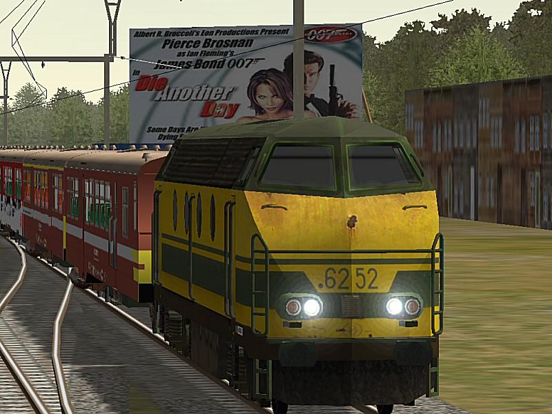 NMBS/SNCB HLD6252 pulls a rake of M2 coaches , on a Belgian fictional route.Notice the advertising for James Bond in the back !!