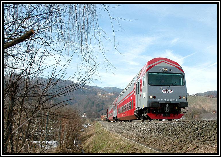 R 8567 auf dem Weg von Graz nach Wies am 27.3.2006 kurz nach dem Bahnhof Deutschlandsberg beim Anstieg auf die Leibenfelder H�he.