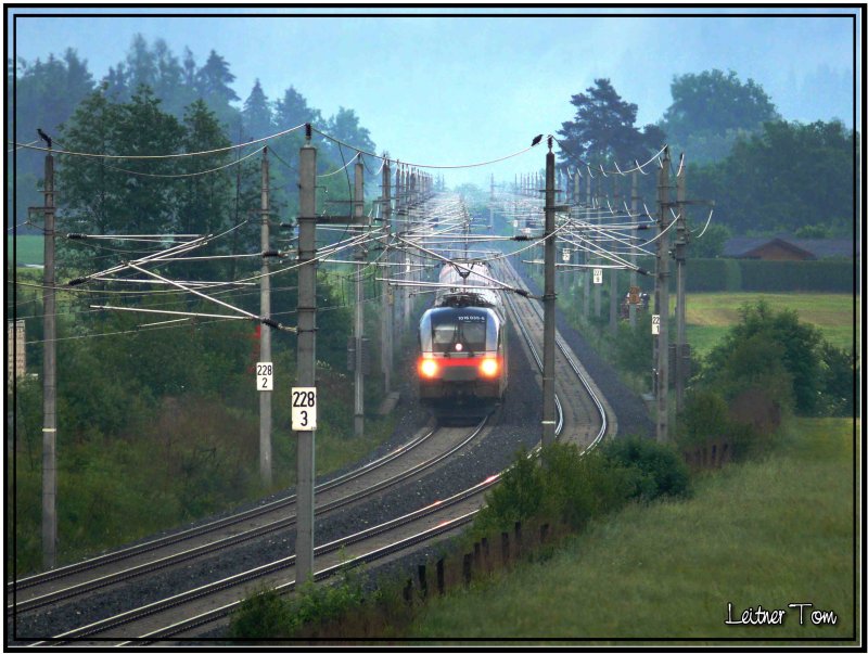 Railjet 1016 035-6 im Regen. 
Spielberg 23.05.2007