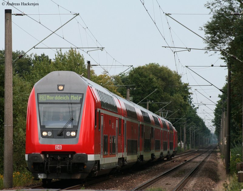 RE 4418 (Hannover Hbf-Norddeich Mole) mit Schublok 146 102-9 in Heidkrug 20.8.09