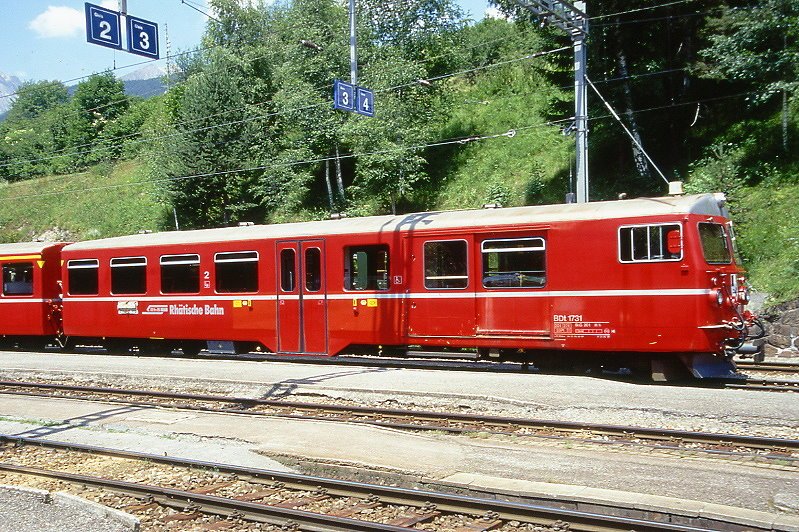RhB - BDt 1731 am 04.07.1999 in Filisur - 2.Klasse Steuerwagen mit Gepckabteil fr Ge 4/4 I 601 bis Ge 4/4 I 610, ab 2003 auch Ge 4/4 III - Baujahr 1956 - bernahme 26.05.1989 - SIG/RhB - Fahrzeuggewicht 20,00t - Sitzpltze 31 - Ladegewicht 2,00t - LP 18,22m - zulssige Geschwindigkeit 90 km/h - 3=26.05.1989 - Logo RhB in deutsch - Lebenslauf: ex AB4 1513 - 1964 AB 1513 - 26.05.1984 BDt 1731 - Hinweis: Klassezahlen klein, dnne Betriebsnummern, runde Scheinwerfer!
