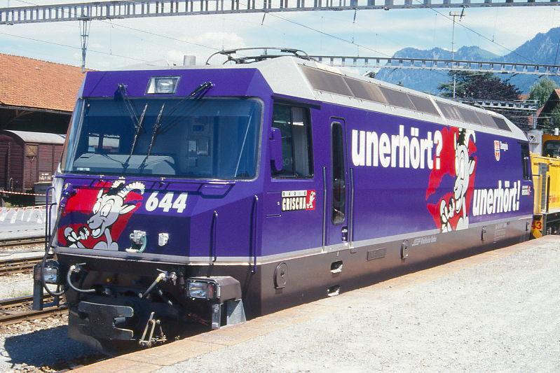 RhB - Ge 4/4 III 644  SAVOGNIN  am 07.06.1997 in Chur Arosabahn-Abstellanlage unter Gleichstrom nur abgebgelt mglich - Drehstrom-Universallokomotive - bernahme 14.04.1994 - SLM5492/ABB - 3200 KW - Gewicht 62,00t - LP 16,00m - zulssige Geschwindigkeit 100 km/h - Logo RhB deutsch - Werbung: UNERHRT - gescanntes Dia
