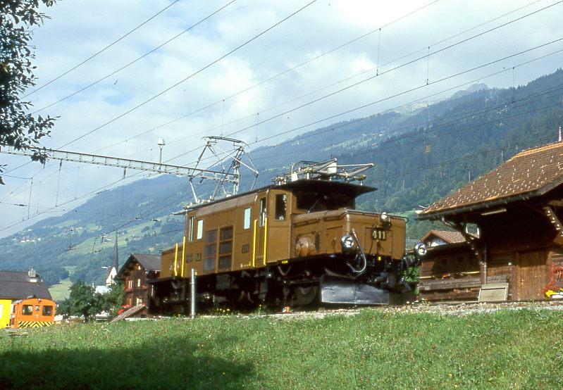 RhB Gterzug 5738 von Disentis nach Landquart vom 27.08.1997 in Trun mit E-Lok-Oldtimer Ge 6/6I 411 solo.