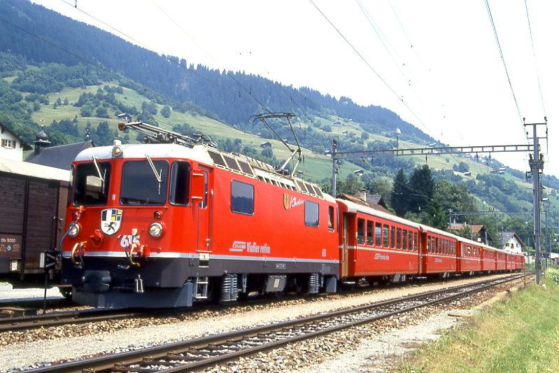 RhB REGIONALZUG 741 von Chur nach Disentis am 25.06.1994 in Trun mit E-Lok Ge 4/4II 615 - B 2212 - B 2213 - B 2366 - A 1242 - B 2373 - B 2367 - D 4208.
