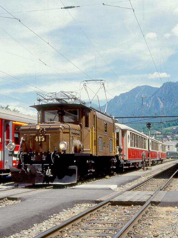 RhB Salonzug 3843 von Landquart nach Chur am 07.06.1997 in Chur mit E-Lok Ge 6/6 I 415 - AS 1112 - AS 1143 - AS 1142. Hinweis: Salonwagen inzwischen umgebaut.

