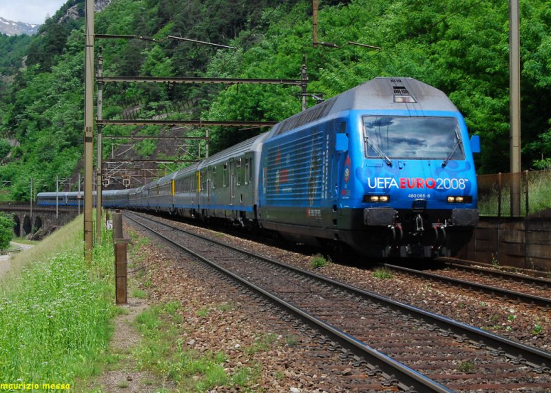 SBB Re460 065 painted with  UEFA EURO 2008  livery, on the Gotthard line, near Lavorgo, leading the EC 175  Cinque Terre  on the 14th of June in 2008