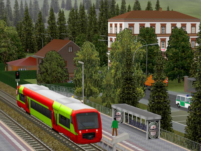Screenshot einer Modellbahnanlage, die mit der Simulation Eisenbahn.exe Professional ohne besonderes Vorbild frei gestaltet wurde. Ein Regioshuttle an einem Haltepunkt.