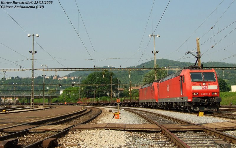 The DB BR 185 099 with another BR 185 is waiting to start from Chiasso Smistamento with a freight train for Germany.
