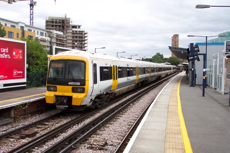  This is Greenwich. Platform one: Southwestern-Service to Dartford via Maze Hill, Westcombe Park, Charlton, Woolwich Dockyard, Woolwich Arsenal, Plumstead, Abbey Wood, Belvedere, Erith and Slade Green 
Class 465 in Greenwich