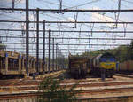 Die Class 66 266 024-9 von Railtraxx steht in Montzen-Gare(B) mit einem Güterzug aus Linz-Voestalpine(A) nach Antwerpen-Waaslandhaven(B). 
Aufgenommen in Montzen-Gare(B). 
Bei Sommerwetter am Nachmittag vom 15.7.2018.