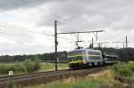 HLE 2018 kommt mit einem unendlich langen Autoleerzug vom Antwerpener Hafen. Hier aufgenommen am 02/07/2011 bei Ekeren.  