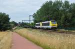 Das Doppelgespann 1303 und 1301 zieht einen Stahlzug Richtung Lüttich, aufgenommen am 24/07/2015 auf der Linie 34 bei Hoeselt.
