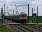 IC2432 Dinant - Bruxelles-Midi mit den Triebwagen 401 und 371 (AM80 Break) aufgenommen am 29/05/2010 an einem Bahnbergang bei Beuzet-Gembloux.