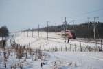 Thalys PBKA Paris-Kln zieht eine Schneewolke auf der Linie LGV 3 bei Limbourg.