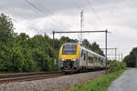 Während anderswo die Sonne schien, lag am 31. Mai über dem Norden Belgiens eine geschlossene dicke Wolkendecke. Hier Desiro 08094 der SNCB/NMBS als IC4133 Leuven - Gent-Sint-Pieters in Hever auf der Linie 53.