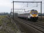 SNCB-Triebwagen 424 der Serie AM 80 (Break) auf dem Weg in Richtung Tongeren. Aufgenommen am 20/02/2010 in 's Herenhelderen.