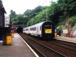 479 mit IC 909 Tournai-Herstal auf Bahnhof Lige Jonfosse am 14-7-1998.