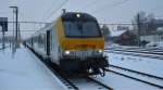 IC 506 mit Schublok 1356 aus Oostende legte am 5.01.10, hier in Welkenraedt, seinen letzten Halt ein, um in baldiger Krze den Endbahnhof Eupen zu erreichen.