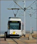 In Middelkerke verlsst  de Kusttam  die Nordseekste und wird zur Stadtbahn. Am 27.03.2011 erreicht der Wagen N 6033 die Haltestelle De Greefplein, um kurze Zeit spter seine Fahrt nach Westende fortzusetzen. (Jeanny)  