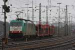 Die Cobra 2823 fhrt mit einem Autozug von Aachen-West nach Montzen/Belgien bei Regen.
27.2.2011