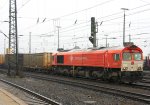 Die Class 66 DE6312  Alix  von Crossrail steht in Aachen-West mit einem Containerzug und wartet auf die Abfahrt nach Belgien bei Regenwetter am 10.3.2012.