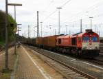 Die Class 66 DE6310  Griet  von Crossrail steht in Aachen-West mit einem sehr langen P&O Ferrymasters Containerzug und wartet auf die Abfahrt nach Zeebrugge(B). Aufgenommen vom Bahnsteig in Aachen-West bei Sonne und Regenwolken am Nachmittag vom 6.4.2014. 