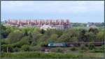 Natur und Technik,vereint an der Montzenroute am Gemmenicher Weg bei Aachen. Hier der Blick auf die Strecke nach Belgien hinauf.Im Hintergrund ragt das Klinikum der RWTH hervor. Szenario vom 07.Mai.2014.