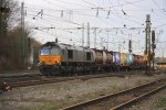 Die Class 66 DE6306 von DLC Railways fhrt mit einem Containerzug von Aachen-West nach Belgien am 14.1.2012.