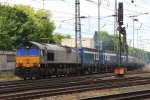 Die Class 66 DE6302 von DLC Railways fhrt mit einem KLV-TTS-Zug aus Piacenza(I) nach Bierset-Awans(B) bei der Ausfahrt aus Aachen-West und fhrt in Richtung Montzen/Belgien bei Sonnenschein am