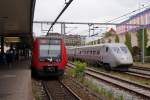 Kopenhagen: DSB S-Bahn 9113 der Linie-Bahn C S anlsslich einer Begegnung mit einem SJ X 2000 am 6.
