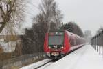 Ein S-Bahnzug der DSB auf Auffahrt zu Bahnhof Peter Bangs Vej.30/1/2014.