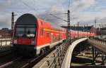 Hier ein RE7 von Berlin Zoologischer Garten nach Wünsdorf-Waldstadt, bei der Ausfahrt am 25.2.2012 aus Berlin Hbf.