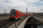 Hier ein RE1 (RE18069)  Baumblten-Express  von Werder(Havel) nach Berlin Ostbahnhof, bei der Ausfahrt am 1.5.2013 aus Berlin Hbf. 