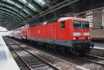 Hier 143 306-9 mit einer RB14 (RB18916)  Airport-Express  von Berlin Ostbahnhof nach Nauen, dieser Zug stand am 30.6.2015 in Berlin Ostbahnhof.