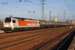 Hier 264 012-6 mit einem Kesselwagenzug, bei der Durchfahrt am 18.1.2014 durch Berlin Schnefeld Flughafen, in Richtung Genshagener Heide.