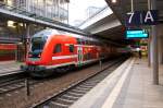 RE5 (RE 4362) von Lutherstadt Wittenberg nach Rostock Hbf in Berlin Südkreuz und gezogen hatte die 112 103-7.