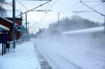 Das war ein Schneegestber: Eine unbekannte Lok der BR 101 schiebt einen IC von Berlin kommend nach Leipzig Hbf, hier bei der Durchfahrt in Burgkemnitz.