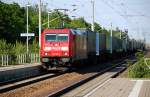 185 310 zieht am 14.05.09 einen LKW-Walter durch Burgkemnitz Richtung Halle(S).