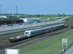 Diesen fr die Schwedische Eisenbahn bestimmender Elektrotriebwagen, X55,konnte man,vor der Verladung auf die Fhre,am 21.Mai 2011 von der Fussgngerbrcke in Mukran ausfotografieren.