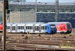 Tele-Blick bei Hitzeflimmern auf 622 919 (Alstom Coradia LINT 54) der vlexx GmbH und 446 027 (DBpzfa | Bombardier Twindexx Vario) des Main-Neckar-Ried-Express (DB Regio Mitte) auf dem Gleisvorfeld von