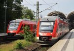 Whrend 648 332-4  Aumhle  als RB75 (RB21272) nach Rendsburg den Kieler Hauptbahnhof verlsst, wartet 648 854-7 auf Ausfahrt ins BW.