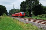 Nachschuß auf eine S8 die nach Mönchengladbach fahrend hier gerade Kleinenbroich verlässt. 30.7.2016