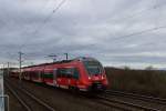 Schwere Regenwolken hängen am Himmel als der 442 755 rsx gen Siegen fahrend hier die S-Bahnhaltestelle Köln Weiden West passiert am Samstag den 8.2 2014