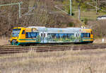 ODEG Regio-Shuttle RS1 in Lietzow ausfahrend nach Sassnitz mit Werbung für den Müritz-Nationalpark und den Naturpark Nossentiner/Schwinzer Heide.