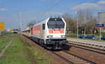 264 004 der hvle führte am 10.04.19 einen Schotterzug durch Wittenberg-Altstadt Richtung Hbf.