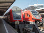 Dosto Steuerwagen nach Nürnberg Hbf neben VT 633 043 mit RE nach Kempten (Allgäu) Hbf in München Hbf, 18.09.2020.