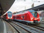 ET 1440 547 mit einer S4 nach Ansbach neben ET 445 083 mit einer RB aus München in Nürnberg Hbf, 31.10.20.