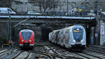 Der DB-Elektrotriebzug 1440 306-7 sowie eine IC2-Garnitur kurz vor der Ankunft am Hauptbahnhof Wuppertal.